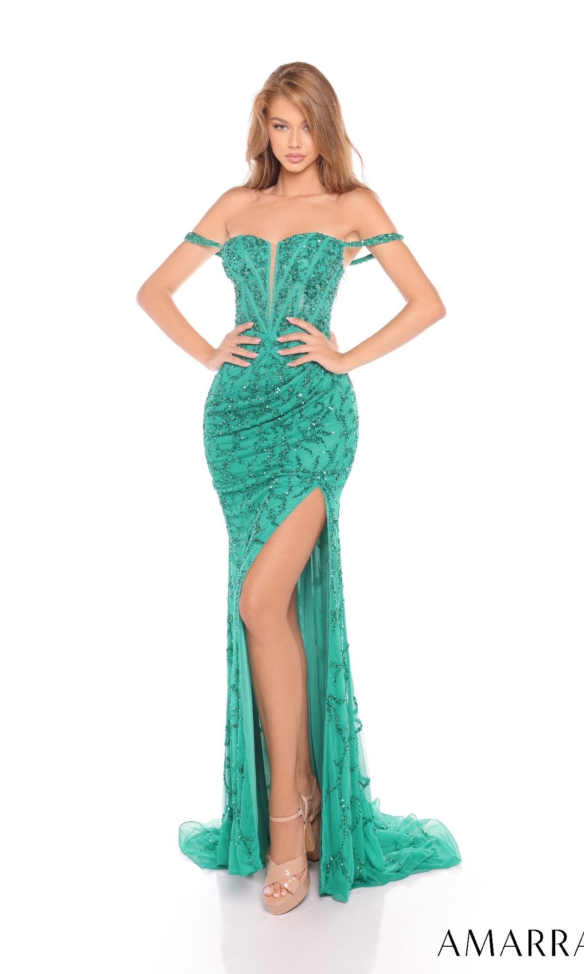 A woman poses against a white background wearing the Amarra 88305 long prom dress—fitted, off-the-shoulder, green sequins with a thigh-high slit—and nude high-heeled sandals.